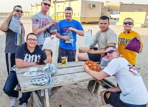 Soldiers showing their received Operation Shoebox gifts